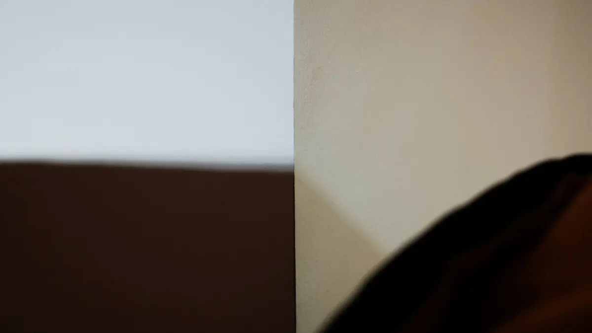 Soft fabric textures in various shades, transitioning from dark brown to light beige.